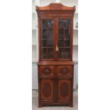 A Georgian style two-part, mahogany finished and crossbanded secretaire bookcase,