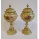 A pair of Royal Worcester ivory glazed china,