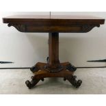 A late Regency mahogany tea table, the rotating, foldover top raised on a tapered, octagonal column,