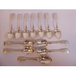 A matched set of twelve Victorian Scottish (Aberdeen) silver fiddle pattern dessert spoons George