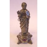 An early 20thC Continental silver standing, robed figure, Christ holding two keys and a Bible,