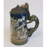A 20thC Villeroy & Boch Mettlach pottery stein with a hinged pewter lid and dragon handle,