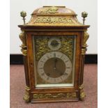 A late 19th/early 20thC Continental walnut cased bracket clock with gilt metal mounts,