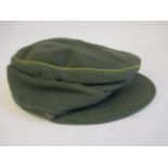 A World War II German military ski cap with green piping (Please Note: this lot is offered subject