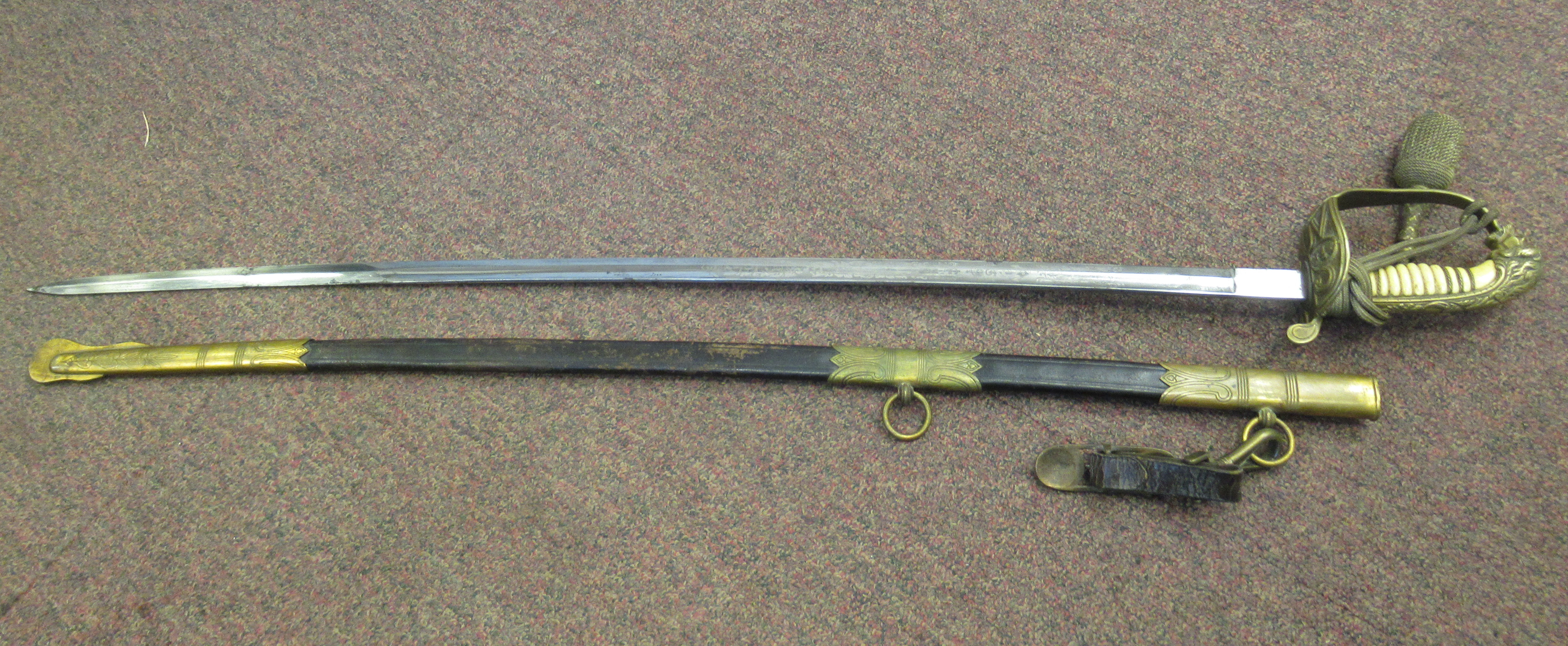 A German Imperial/Third Reich era naval officer's sword, having brass mounts, a lion's head pommel, - Image 2 of 5