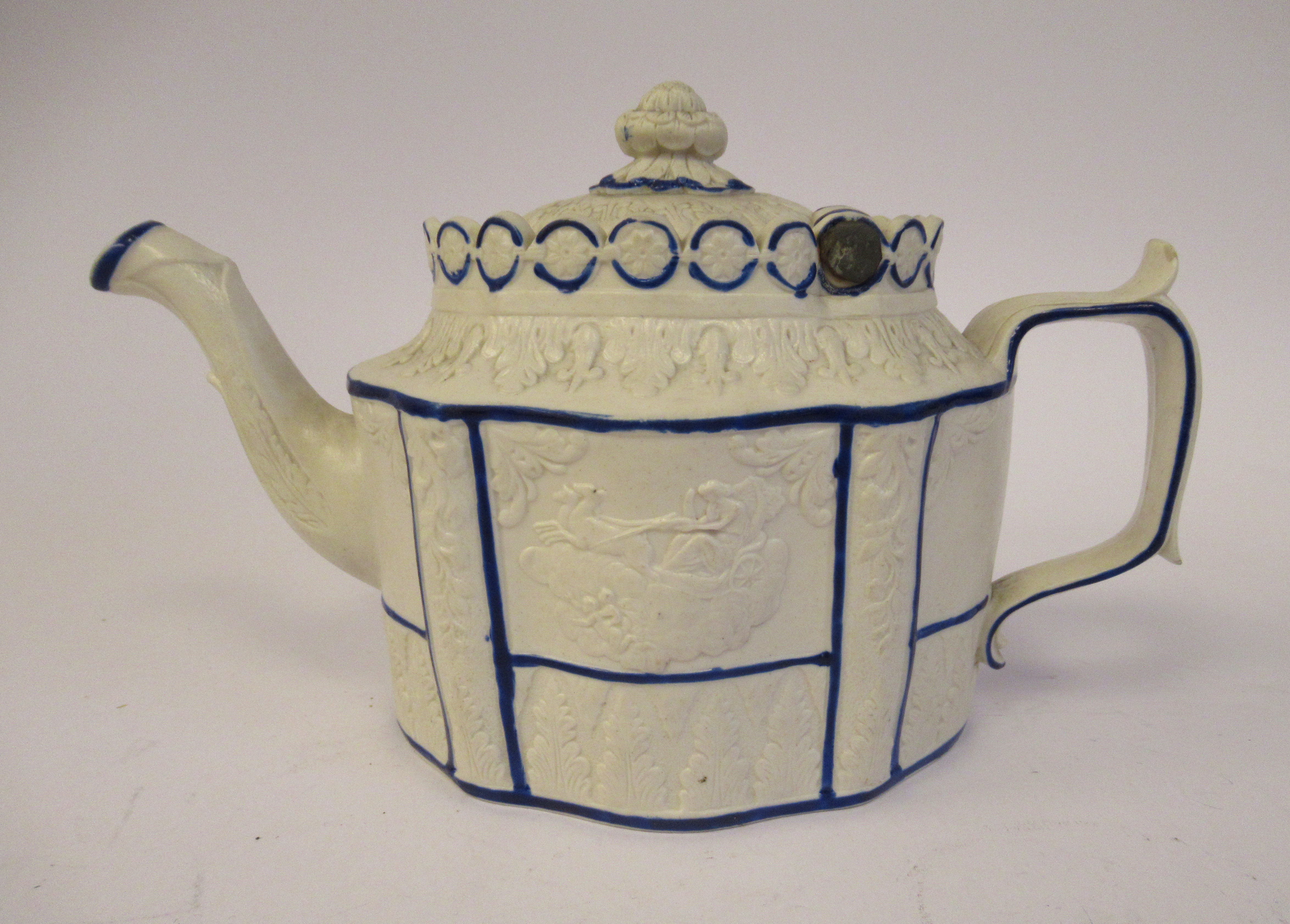 A late 18th/early 19thC Staffordshire naturally coloured biscuit porcelain and blue lined teapot of