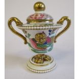 A 19thC porcelain gilded and painted, mask decorated,