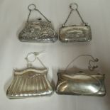 Four similar Edwardian silver folding purses,