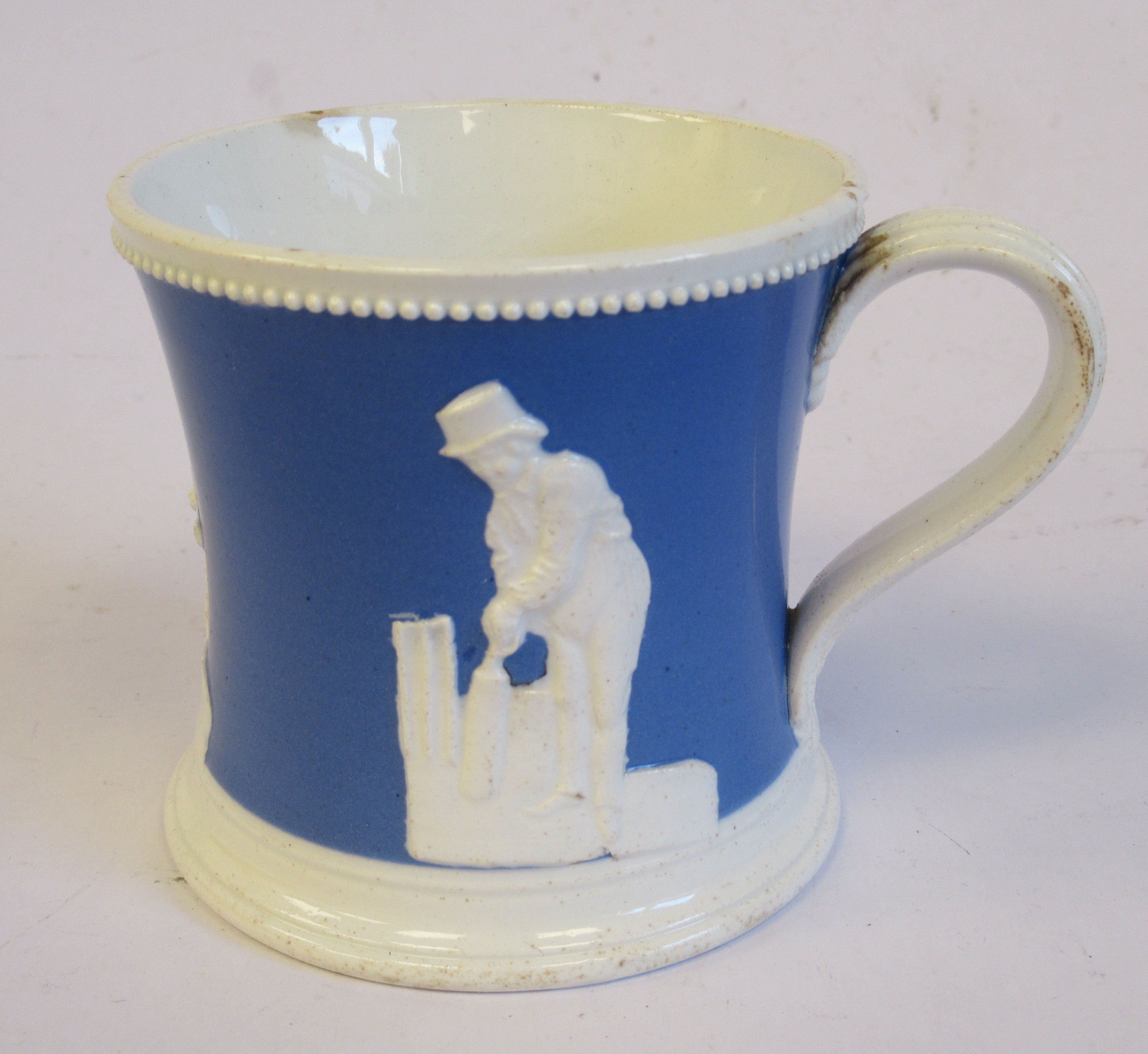 A mid 19thC powder blue and white glazed pearlware mug of waisted, cylindrical form, - Image 2 of 4