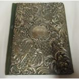 A late Victorian bottle green hide bound correspondence folio, the front board overlaid in silver,