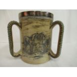A Doulton Lambeth brown and blue glazed stoneware tyg, having straight sides,