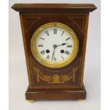 An Edwardian mahogany and marquetry cased mantel clock of box design with gilded ring and rosette