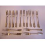 A matched set of fourteen Victorian Scottish (Aberdeen) silver fiddle pattern table forks George