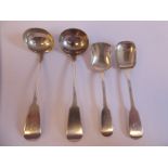 A pair of late Victorian Scottish (Aberdeen) silver fiddle pattern sauce ladles and a pair of