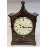 A Regency mahogany cased bracket clock with inlaid lacquered brass inlaid ornament and a pagoda top,