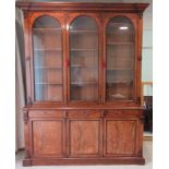 A late Victorian mahogany library bookcase with applied, Gothic inspired ornament,