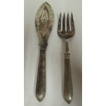 A pair of mid Victorian silver fish servers with decoratively pierced and engraved ornament,