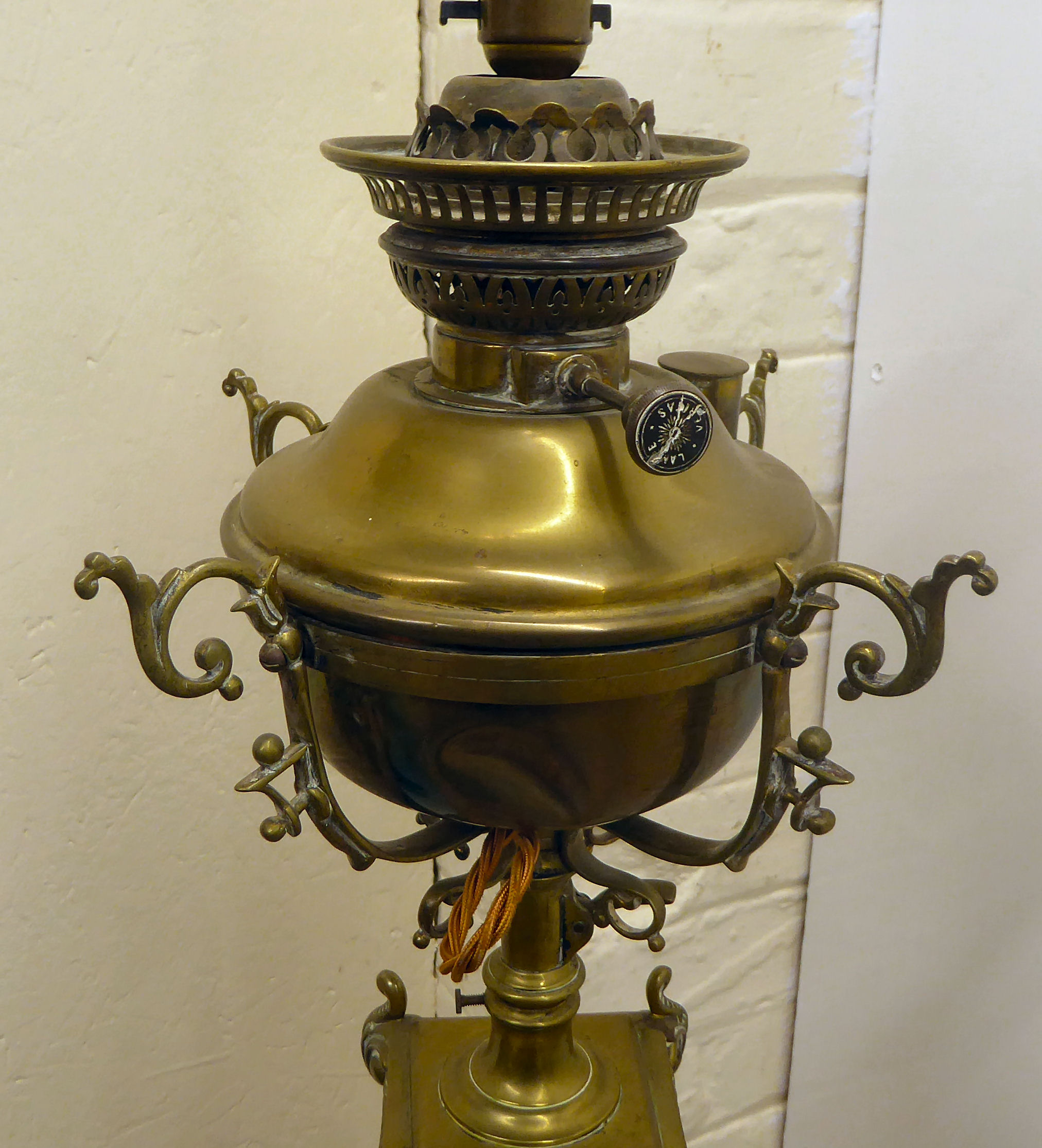 A late Victorian decoratively cast brass, square section lamp standard with a reservoir, - Image 4 of 5