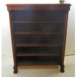 A Regency inspired, mahogany finished and black lacquered, open front bookcase,