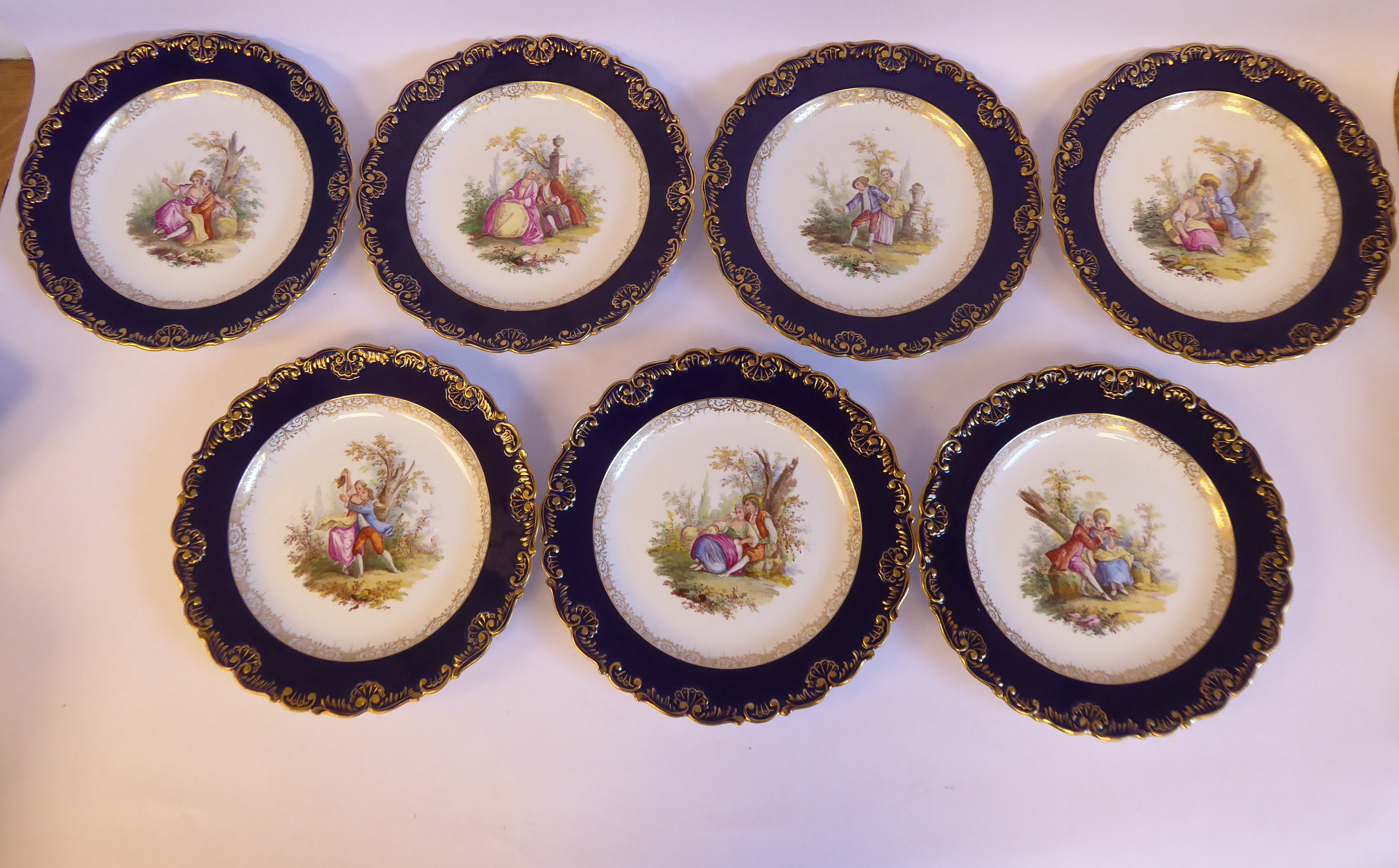 A set of seven late 19th/early 20thC Meissen porcelain wavy edged plates,