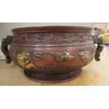An Oriental cast and patinated and part gilded bronze bulbous shaped bowl,