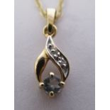 A 9ct gold diamond set pendant,