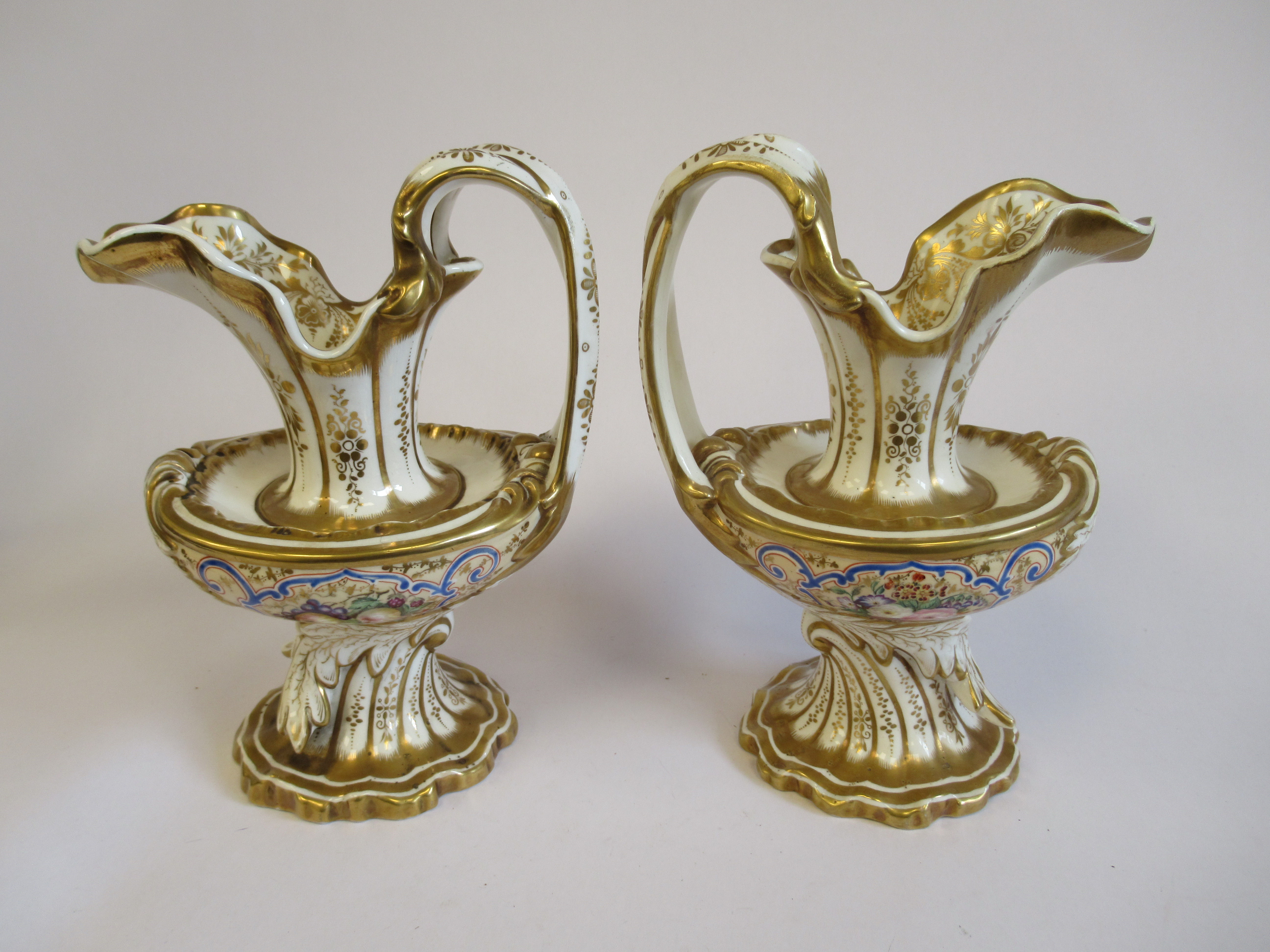 A pair of Copeland Garrett Felspar porcelain ewers with bowl shaped bodies and drawn loop handles,