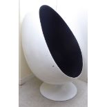 A modern 'retro' design, egg shaped pod chair,