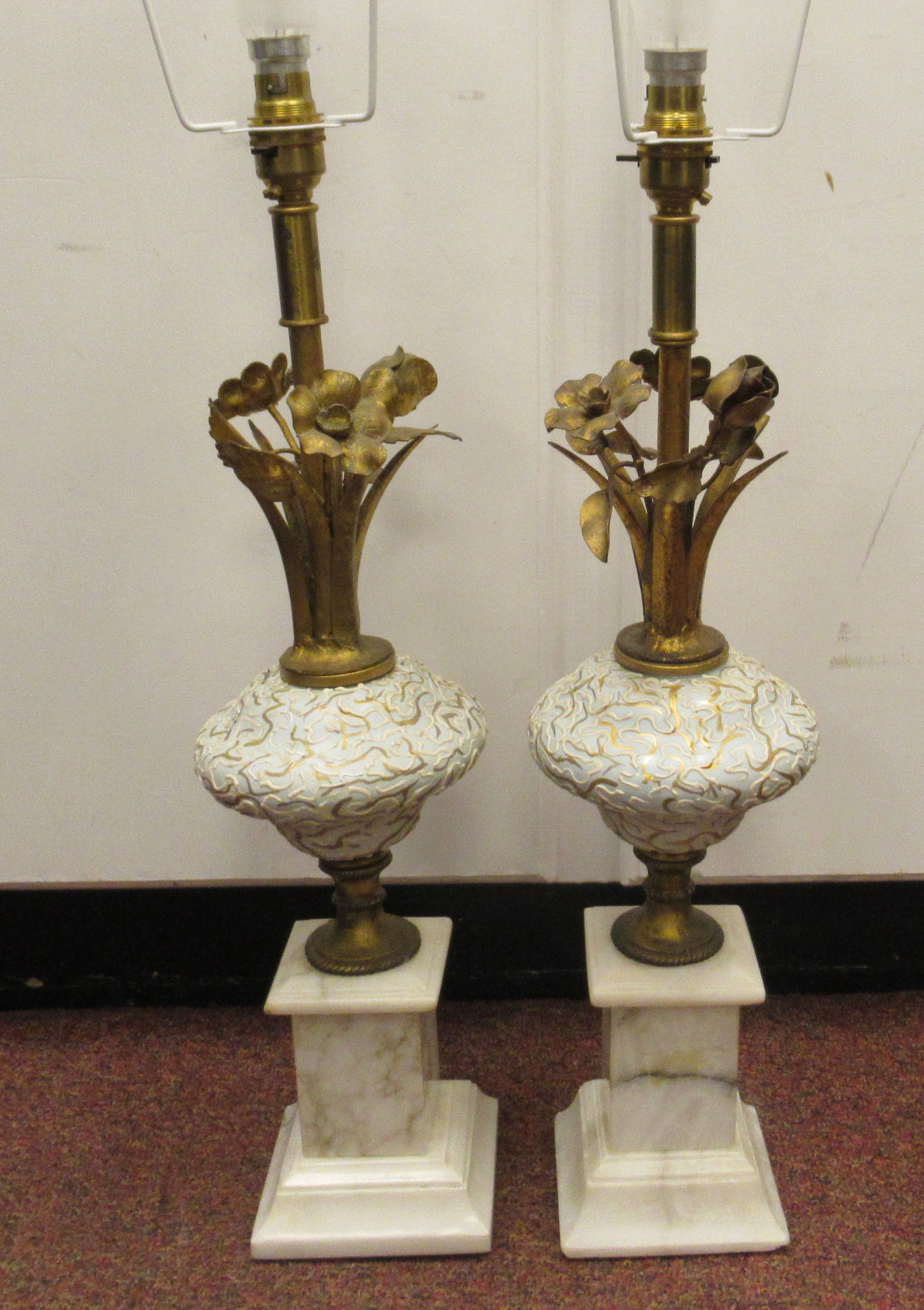 A pair of modern table lamps, each comprising a naturalistically fashioned gilt metal,