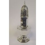 An Edwardian Scottish silver caster of octagonal, pedestal vase design with a decoratively pierced,