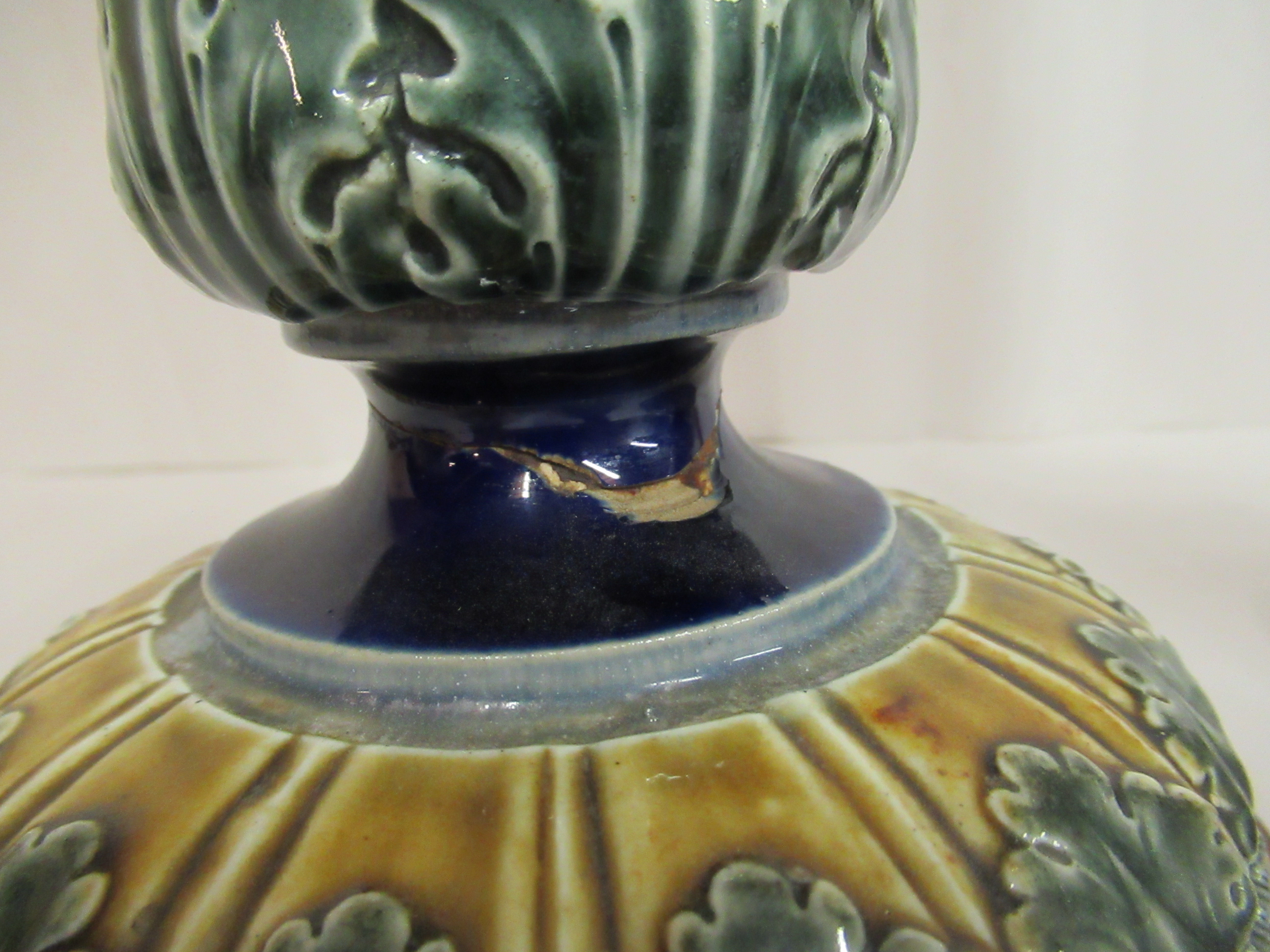 A pair of Doulton Lambeth blue, green and brown glazed stoneware candlesticks, decorated in moulded, - Image 7 of 10