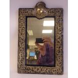 A late Victorian mirror, the dark blue velvet covered and silver mounted frame with pierced,