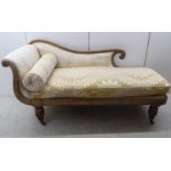A William IV bleached mahogany showwood framed chaise longue with a scrolled end and half height