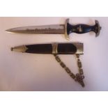 A German SS dagger, the moulded black handgrip with SS,