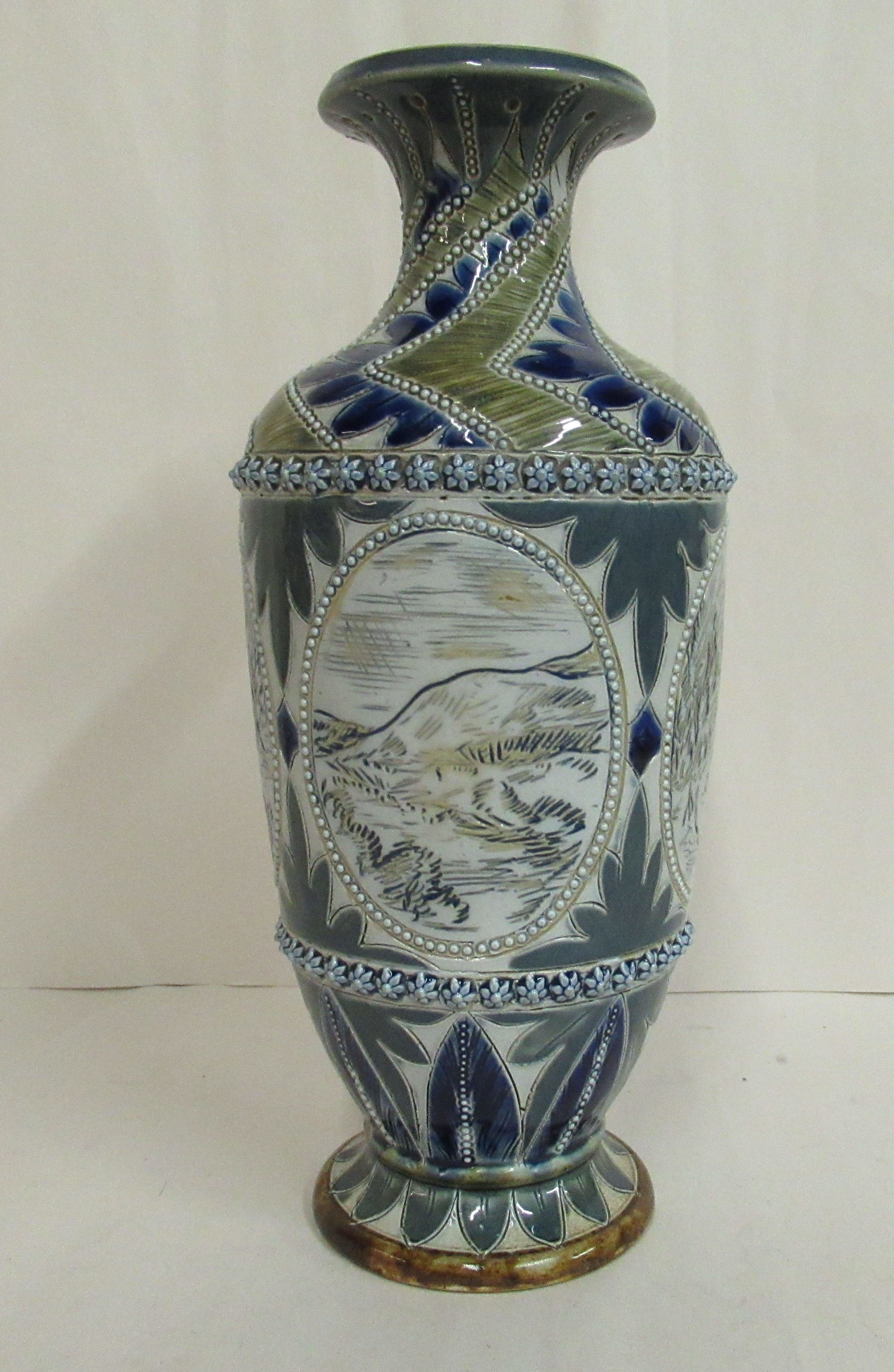 A Doulton Lambeth blue, grey and green glazed stoneware vase of baluster form,