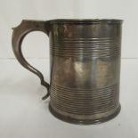 A George III silver half pint Christening tankard with a hollow handle and engraved tramline