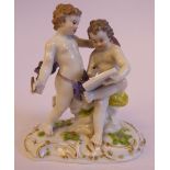 An early 20thC Meissen porcelain group, featuring two cherubic figures with an artist's board (No.