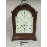 An early 19thC mahogany cased, round arched bracket clock,