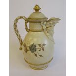 A Royal Worcester blush ivory glazed china jug of oval, bulbous form, having a scrolled loop handle,