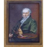 A late 19thC half-length portrait miniature, a seated artist, wearing a green topcoat,