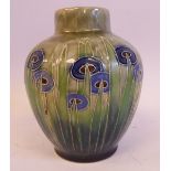 A Royal Doulton stoneware vase of baluster form, decorated in tubeline, tones of green,