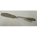 A late Victorian silver fiddle pattern fish slice with decoratively pierced and engraved ornament