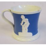 A mid 19thC powder blue and white glazed pearlware mug of waisted, cylindrical form,