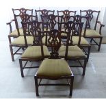 A set of ten Chippendale inspired, mahogany framed dining chairs, the backs with yoke crests,