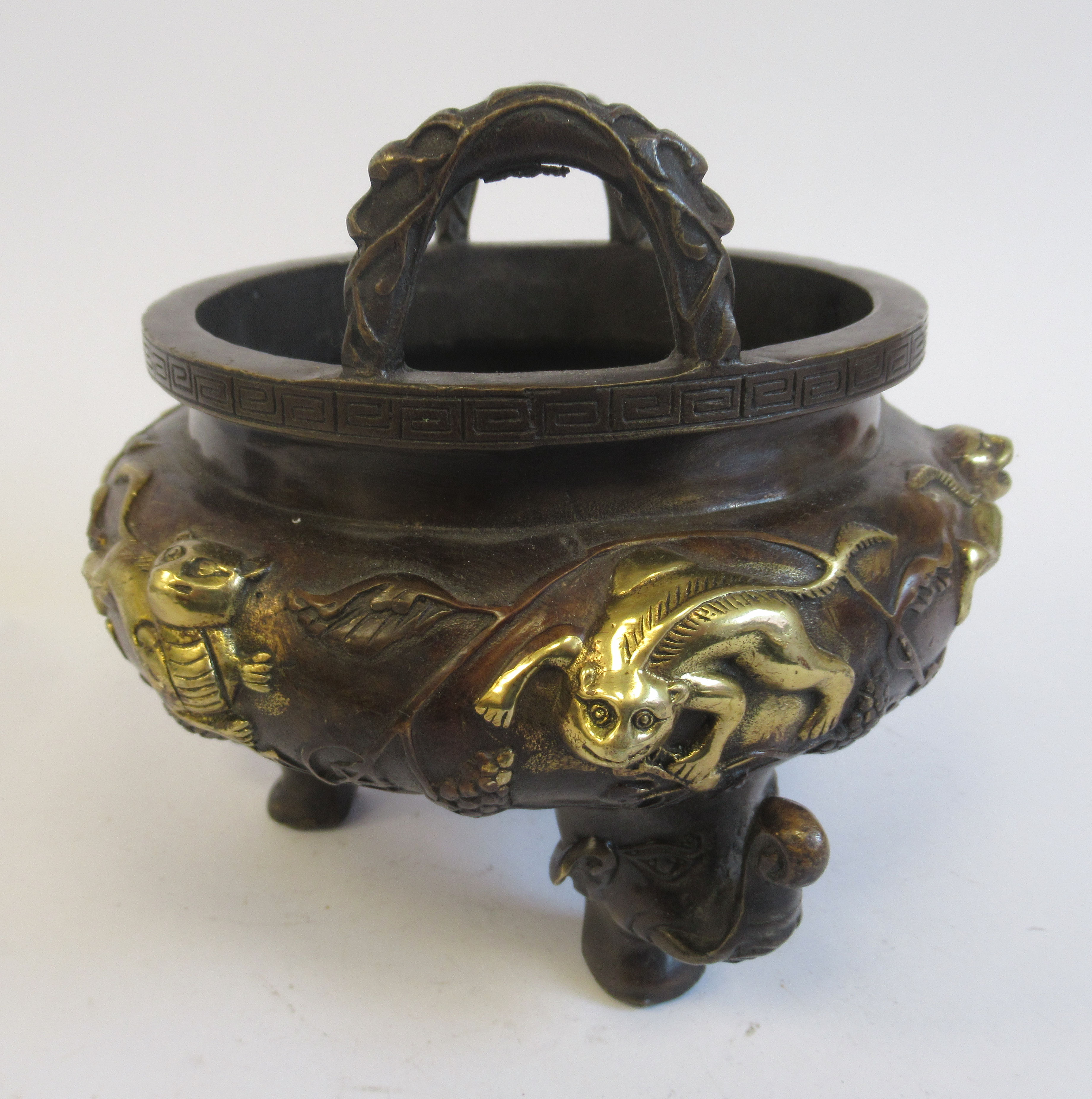 An Oriental cast and patinated and part gilded bronze censer, the bulbous bowl having opposing, - Bild 2 aus 6