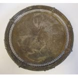A late Victorian silver salver with a scroll engraved surface,