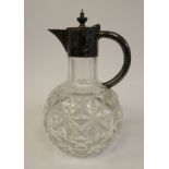 A late Victorian slice cut crystal wine jug of bulbous form with a narrow neck,