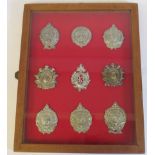 Nine various Scottish regimental cap badges and other insignia,