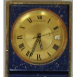 A Jaeger LeCoultre lacquered brass and gilt speckled midnight blue enamel cased traveller's folding