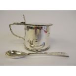 A late Victorian silver drum design mustard pot with gadrooned border, an angular loop wire handle,